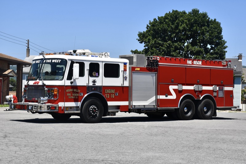 Engine 13-10, a red 1999 American LaFrance Eagle pumper-tanker, parked on the station apron. Photo: Mike and Andrew Sanders.